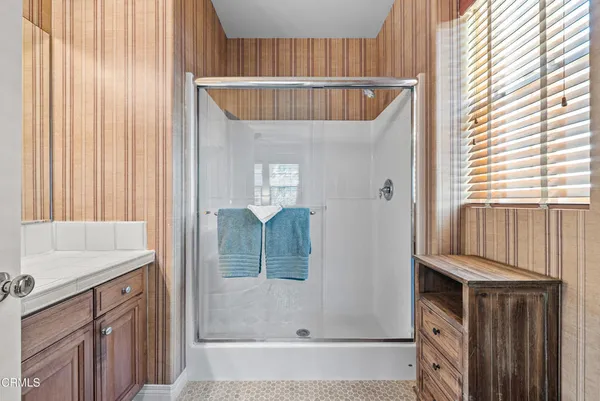 a bathroom with a double vanity sink and mirror