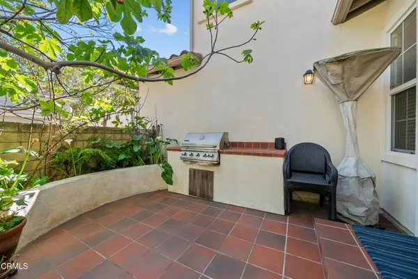 a view of a chairs and table in a backyard