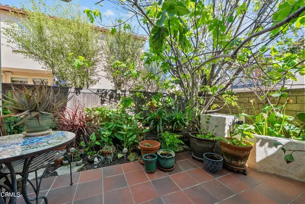 a view of a kitchen with furniture and outdoor space
