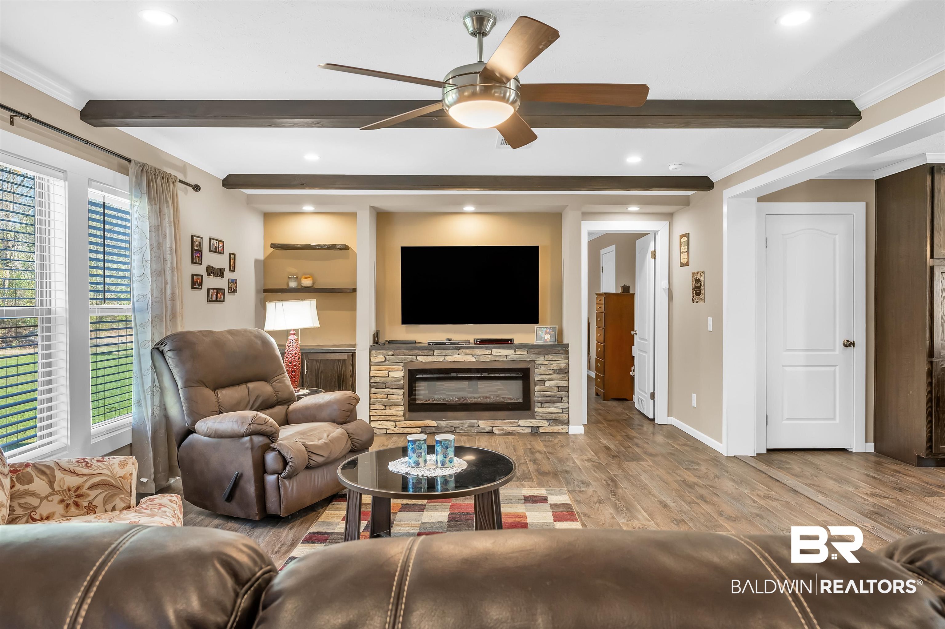 23233 Forland Road Silverhill, AL 36576 - Photo 12 of 33 Living room with a ceiling fan, beam ceiling, baseboards, and wood finished floors