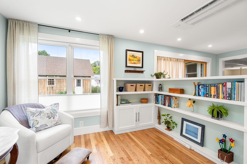 19 Forrest Road Topsfield, MA 01983 - Photo 16 of 39 a living room with furniture and a book shelf