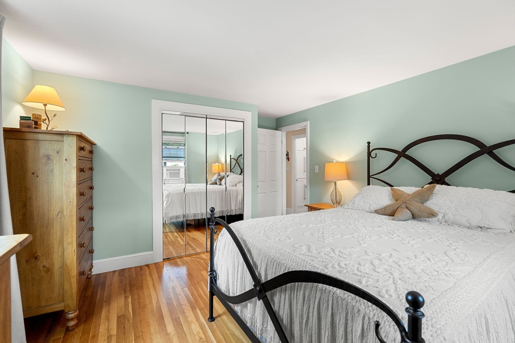 19 Forrest Road Topsfield, MA 01983 - Photo 20 of 39 a bedroom with a bed and wooden floor