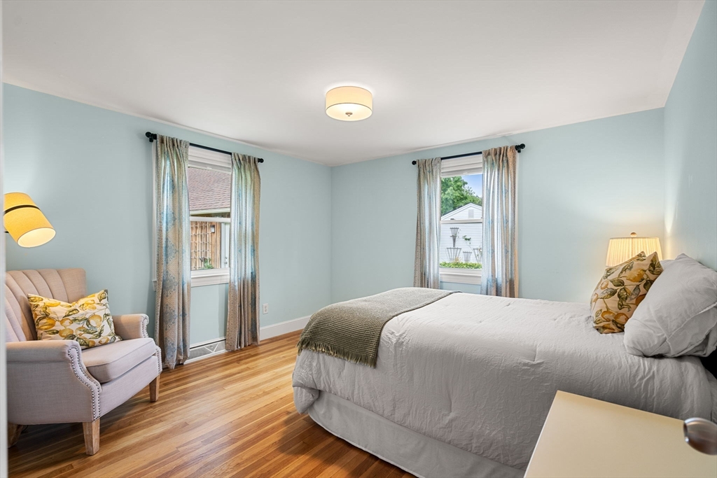 19 Forrest Road Topsfield, MA 01983 - Photo 21 of 39 a bedroom with a bed and wooden floor