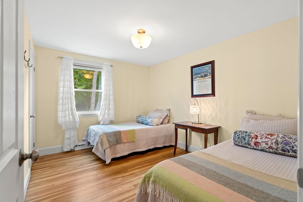 19 Forrest Road Topsfield, MA 01983 - Photo 23 of 39 a bedroom with two beds and a window