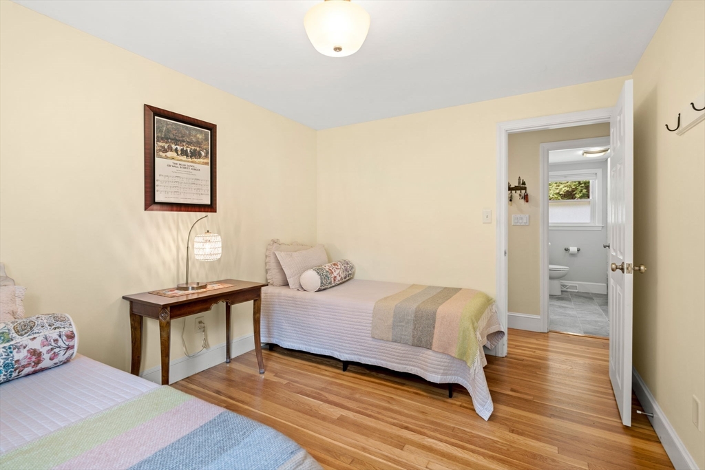 19 Forrest Road Topsfield, MA 01983 - Photo 24 of 39 a bedroom with a bed and a table