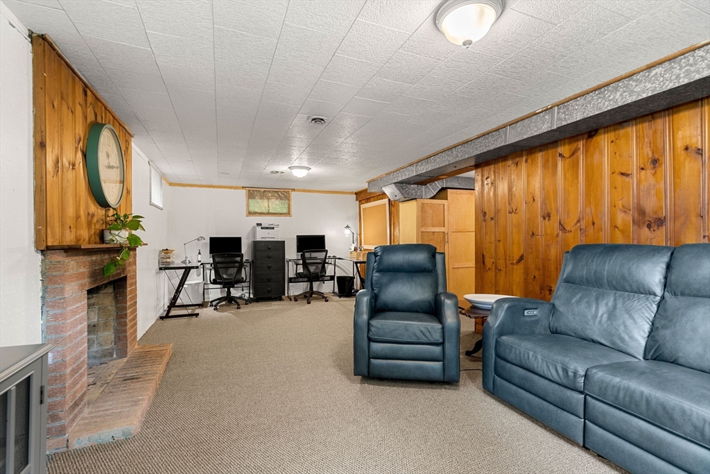 19 Forrest Road Topsfield, MA 01983 - Photo 26 of 39 a living room with furniture a couch and a large window