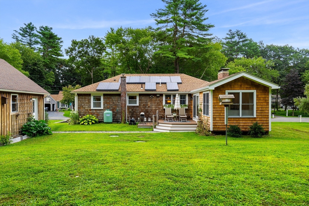19 Forrest Road Topsfield, MA 01983 - Photo 36 of 39 a front view of a house with a garden and porch