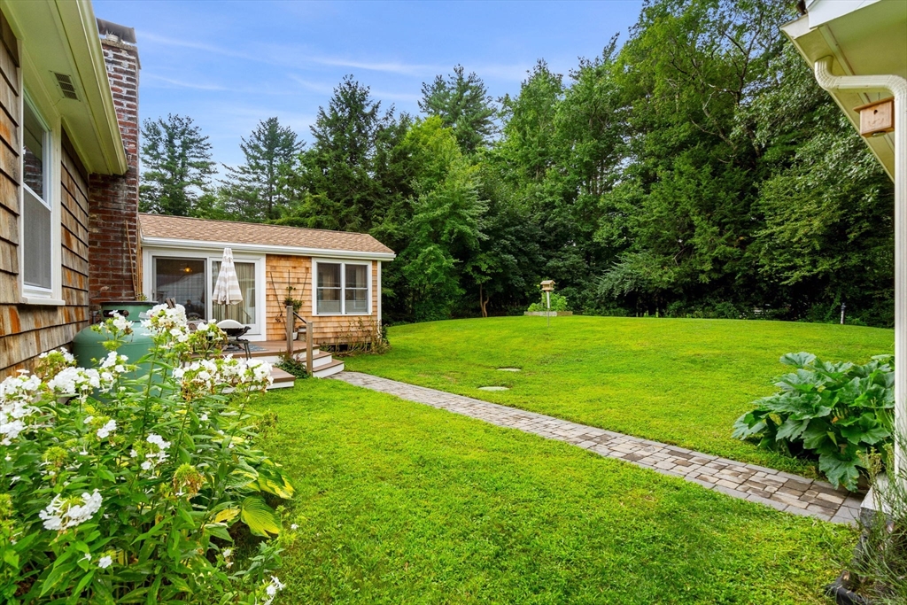 19 Forrest Road Topsfield, MA 01983 - Photo 37 of 39 a view of a house with a yard porch and sitting area