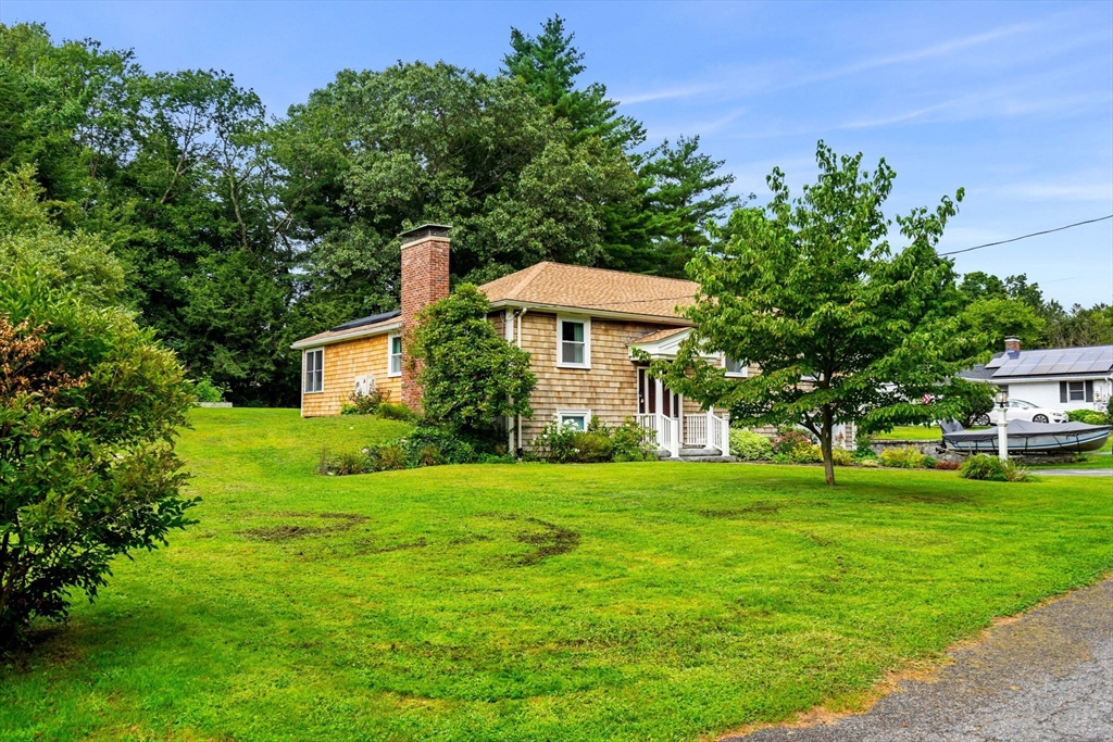 19 Forrest Road Topsfield, MA 01983 - Photo 38 of 39 a front view of a house with a yard