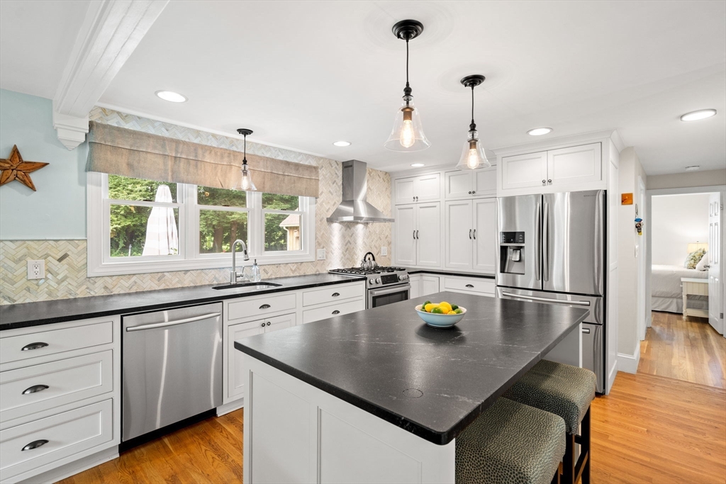 19 Forrest Road Topsfield, MA 01983 - Photo 4 of 39 a kitchen with a sink a counter space appliances and cabinets