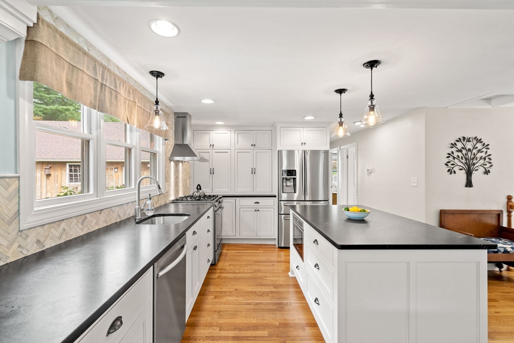 19 Forrest Road Topsfield, MA 01983 - Photo 5 of 39 a large white kitchen with a large window