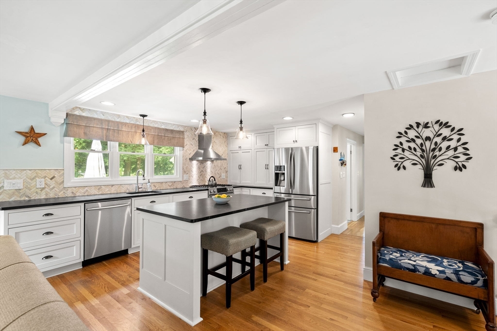 19 Forrest Road Topsfield, MA 01983 - Photo 7 of 39 a kitchen with stainless steel appliances granite countertop a sink and a stove