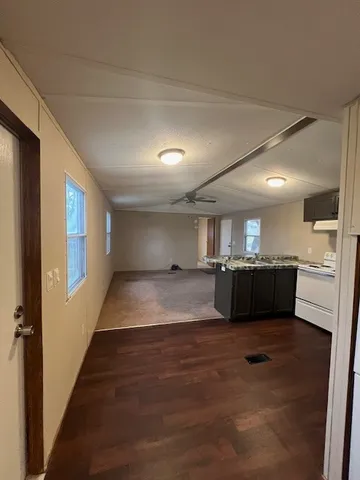 a view of a livingroom with furniture and windows