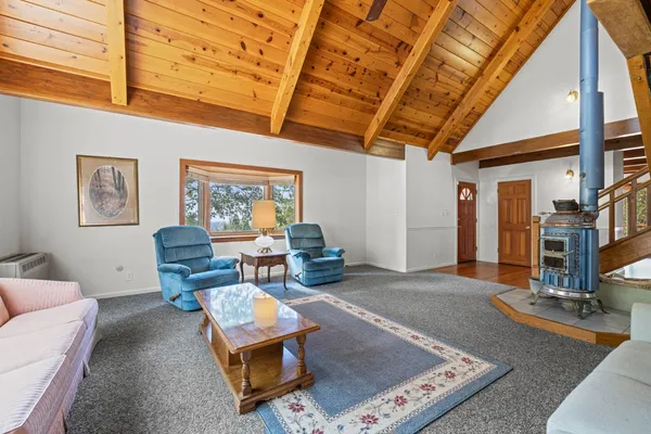 a view of entryway livingroom and hall with wooden floor