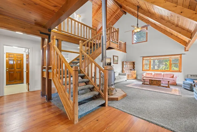 a kitchen with stainless steel appliances granite countertop a sink a stove and a refrigerator