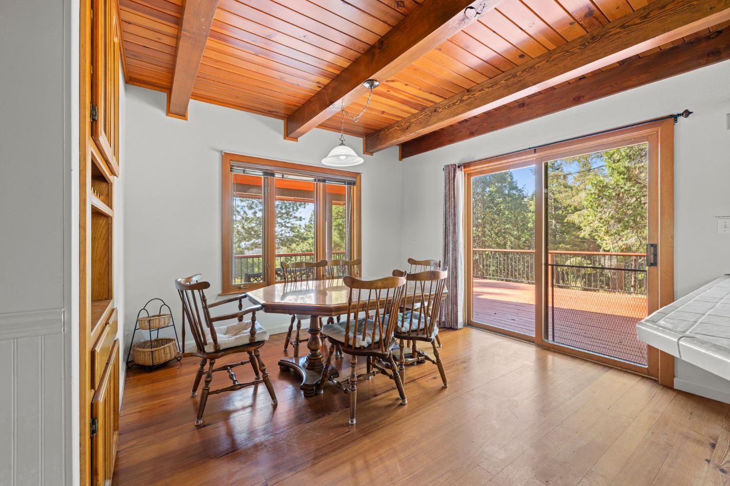 8061 Happy Valley Road Somerset, CA 95684 - Photo 22 of 66 a view of a dining room with furniture and wooden floor