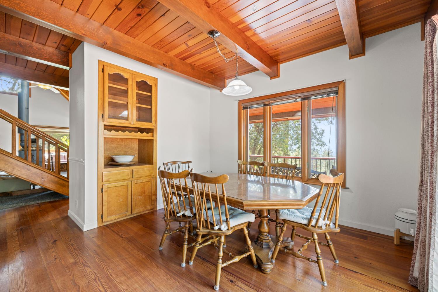 8061 Happy Valley Road Somerset, CA 95684 - Photo 23 of 66 a view of a dining room with furniture window and wooden floor
