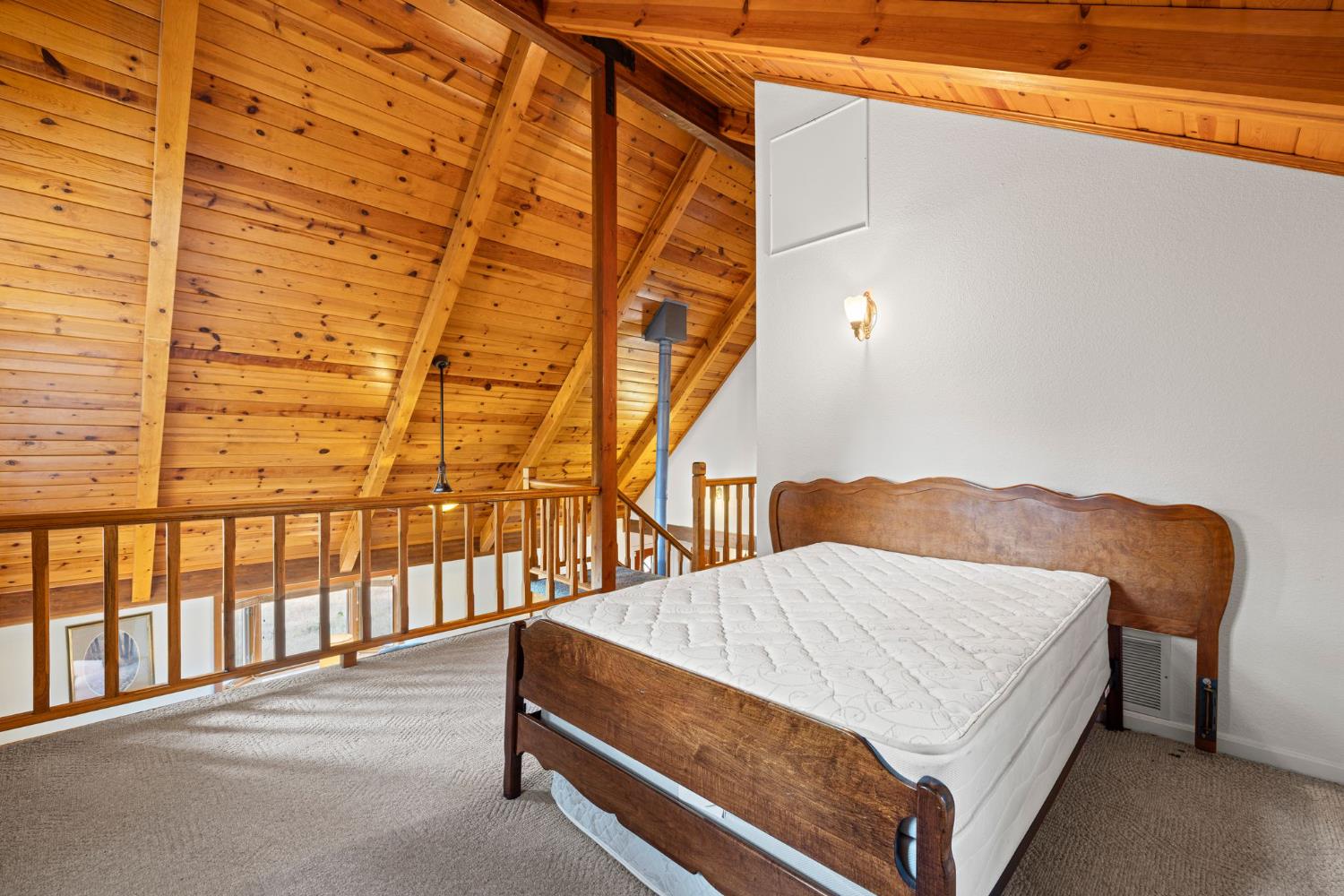 8061 Happy Valley Road Somerset, CA 95684 - Photo 31 of 66 a bedroom with a bed and a window