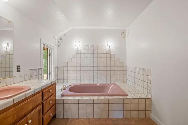 a yellow house with trees in front of it