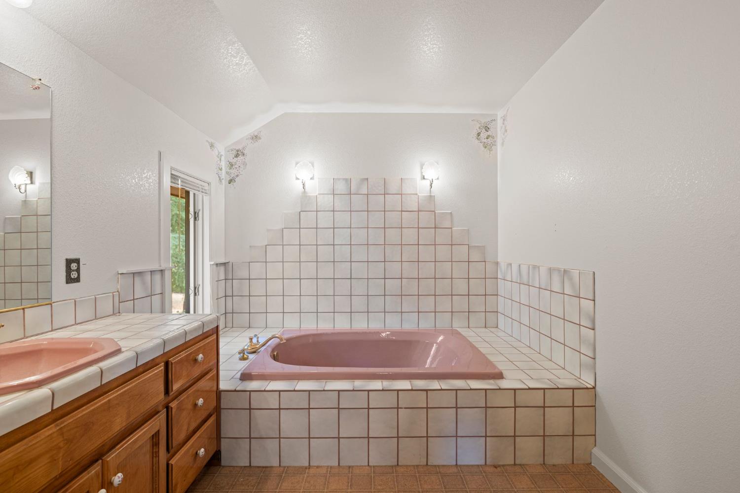 8061 Happy Valley Road Somerset, CA 95684 - Photo 33 of 66 a bathroom with a sink a toilet a mirror and shower