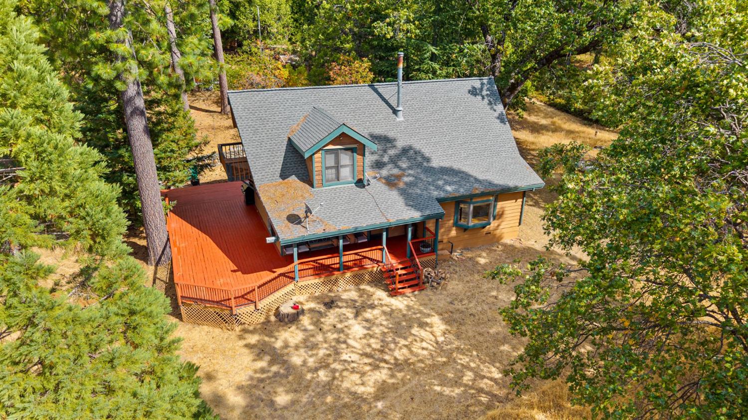 8061 Happy Valley Road Somerset, CA 95684 - Photo 46 of 66 an aerial view of a house with swimming pool and big yard
