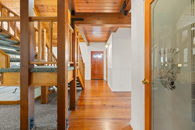 a view of balcony with wooden floor