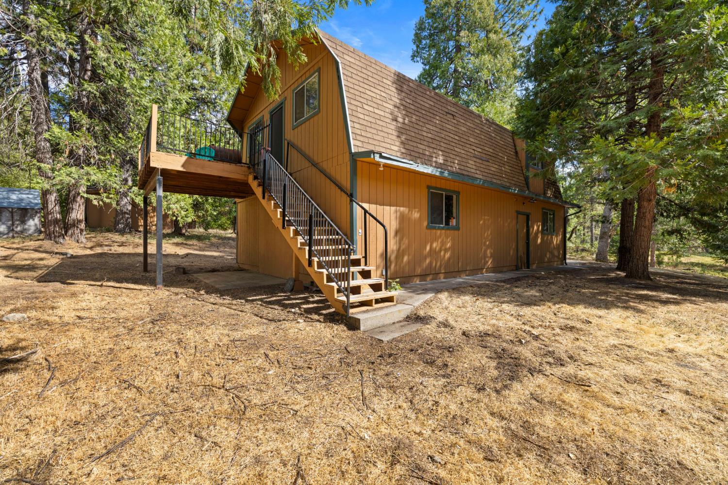 8061 Happy Valley Road Somerset, CA 95684 - Photo 56 of 66 a view of a house with a yard