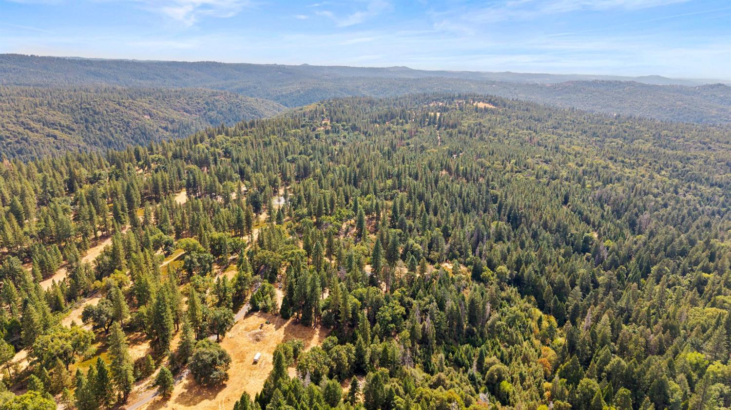 8061 Happy Valley Road Somerset, CA 95684 - Photo 64 of 66 a view of a city with lush green forest