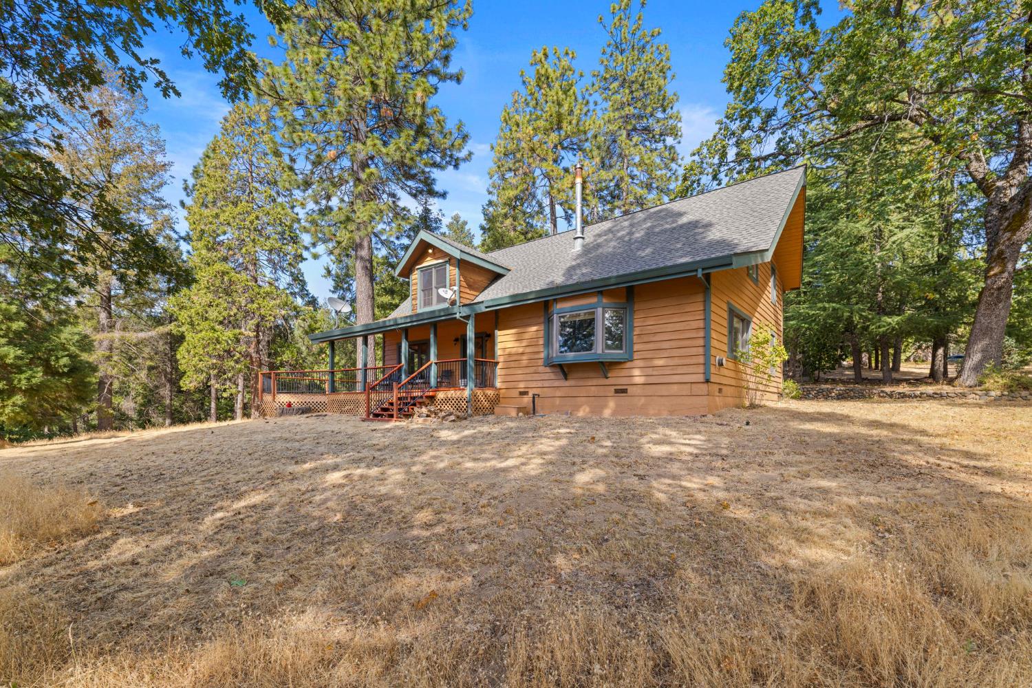 8061 Happy Valley Road Somerset, CA 95684 - Photo 10 of 66 a front view of a house with a yard