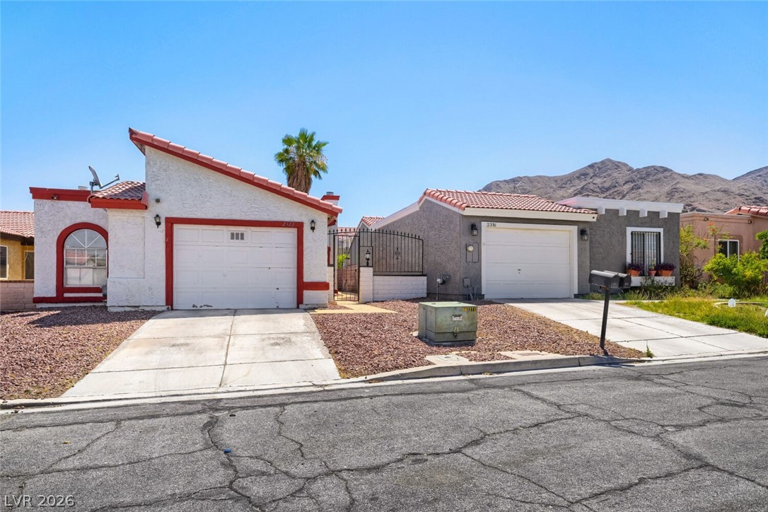 2322 Sabroso Street Las Vegas, NV 89156 - Photo 4 of 17 An inviting desert home with a mountain vista beyond.