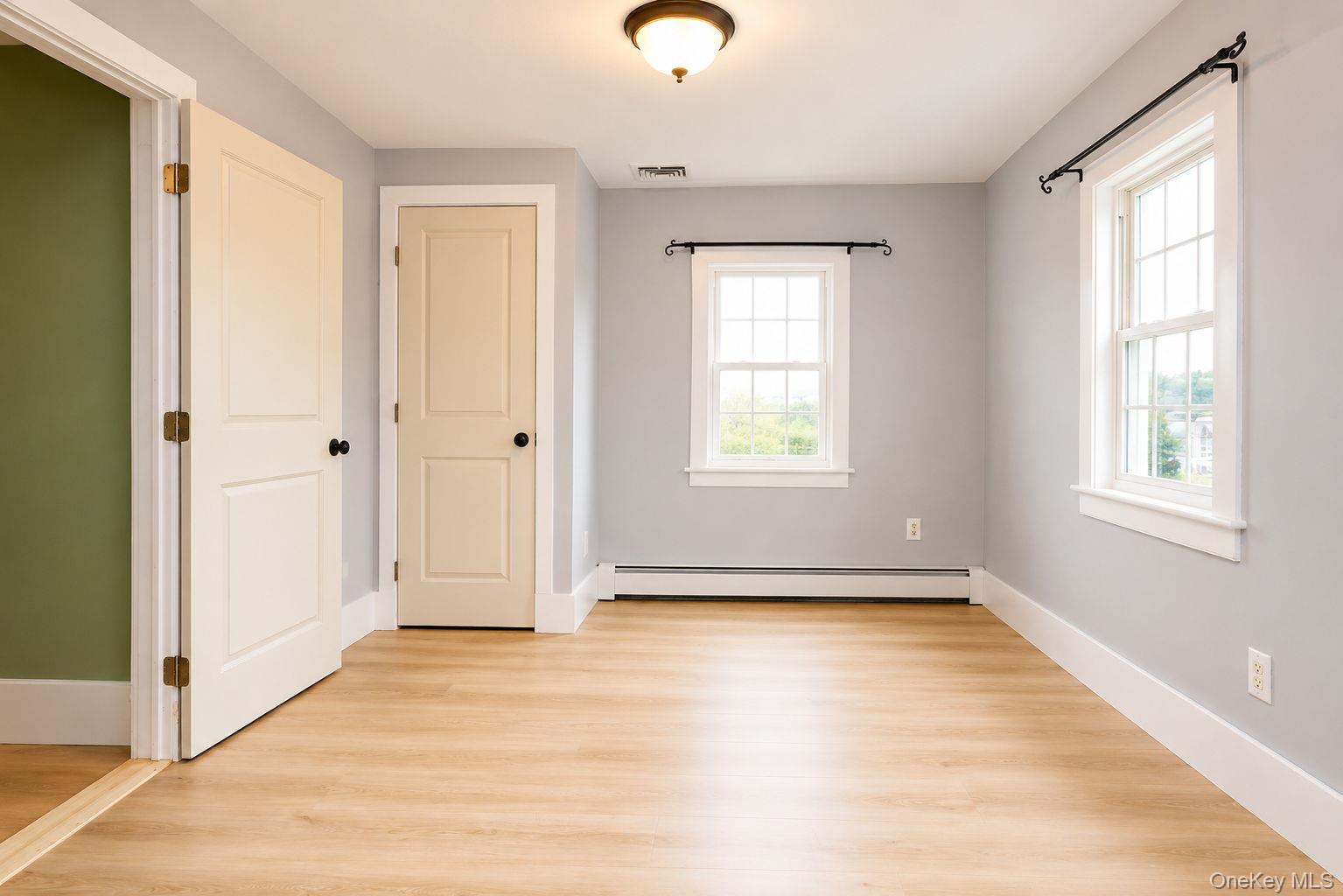 340 Dunn Road Montgomery, NY 12549 - Photo 17 of 34 Bedroom off of the laundry room with vinyl plank flooring and closet