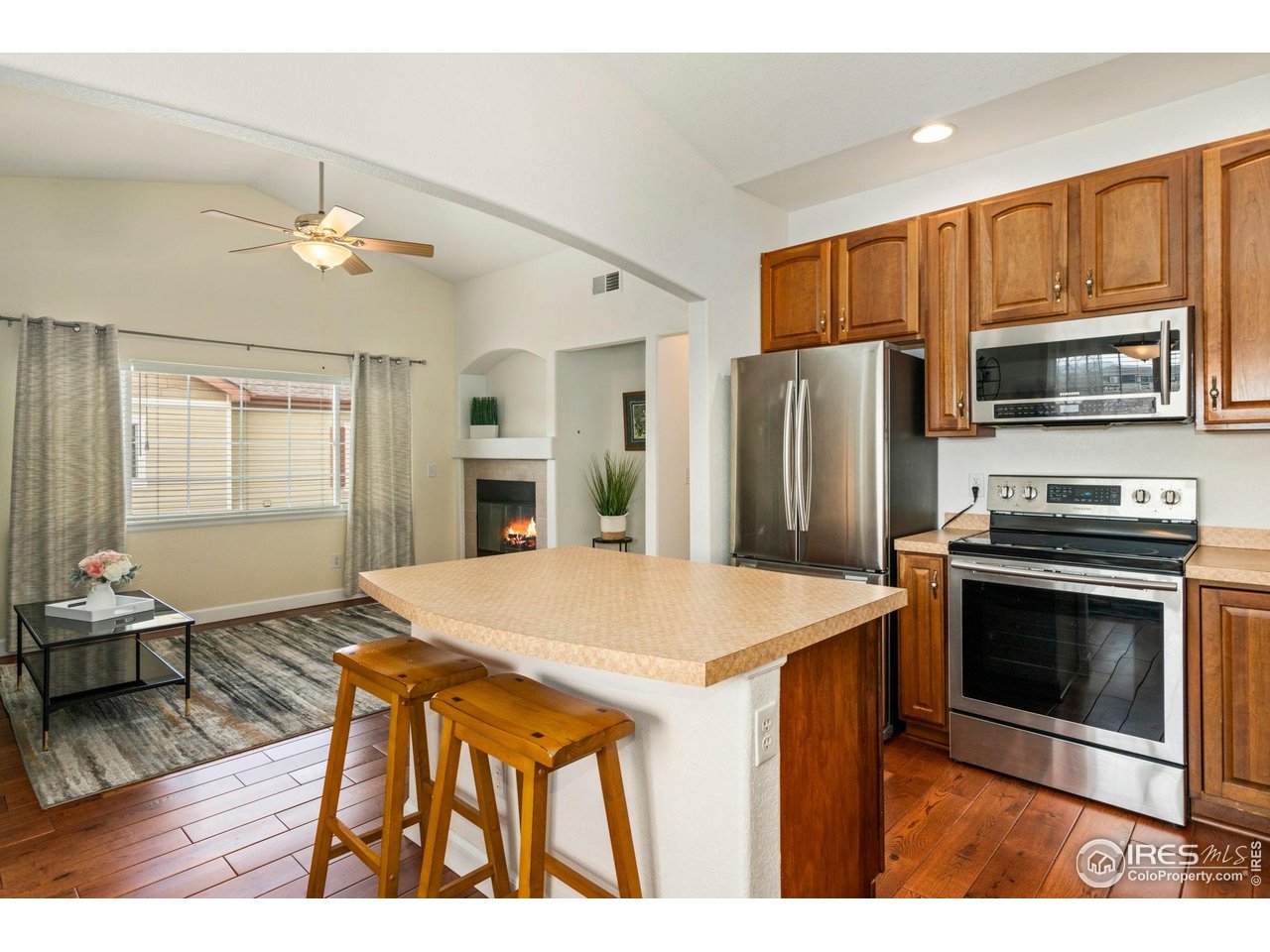 5014 Brookfield Drive, Unit B Fort Collins, CO 80528 - Photo 6 of 18 Hardwood floors, stainless appliances, vaulted ceilings, and a gas fireplace!