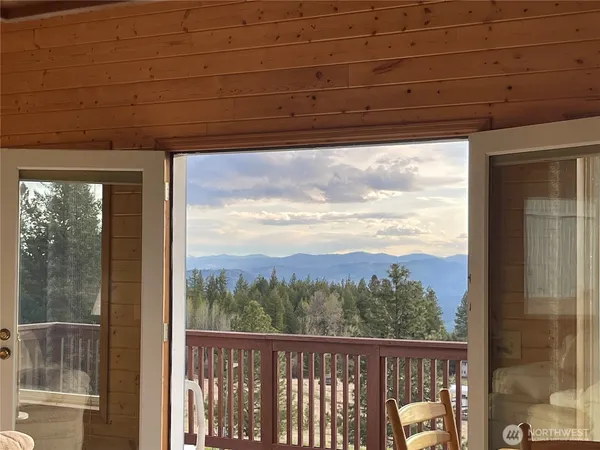 a view of a room with a large window
