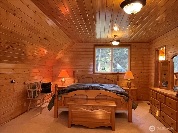 a bed room with a bed and a window