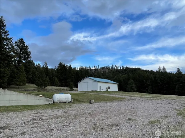 a view of a barn with a yard