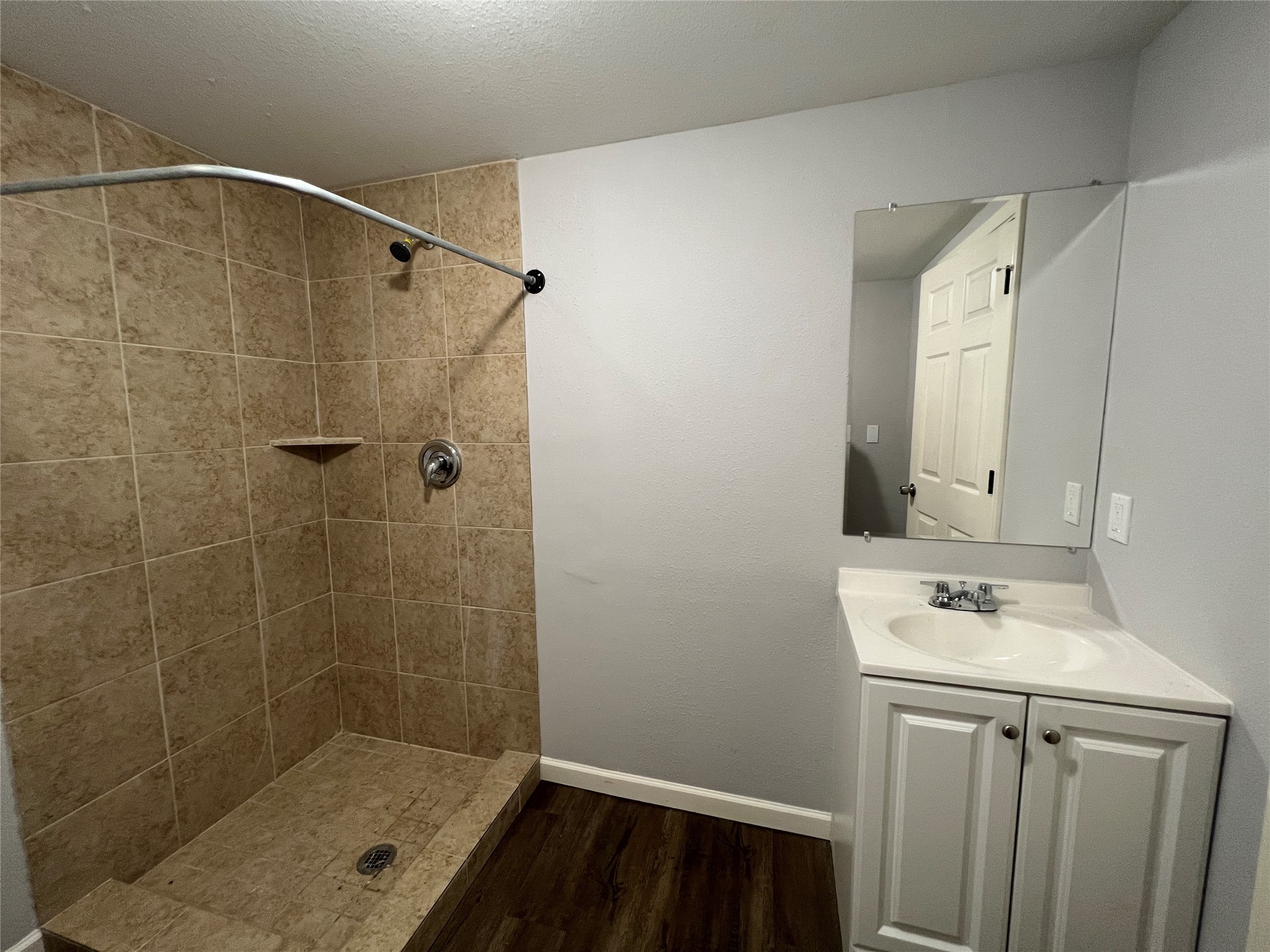 6823 Ave East Houston, TX 77011 - Photo 14 of 16 a bathroom with a sink and a mirror