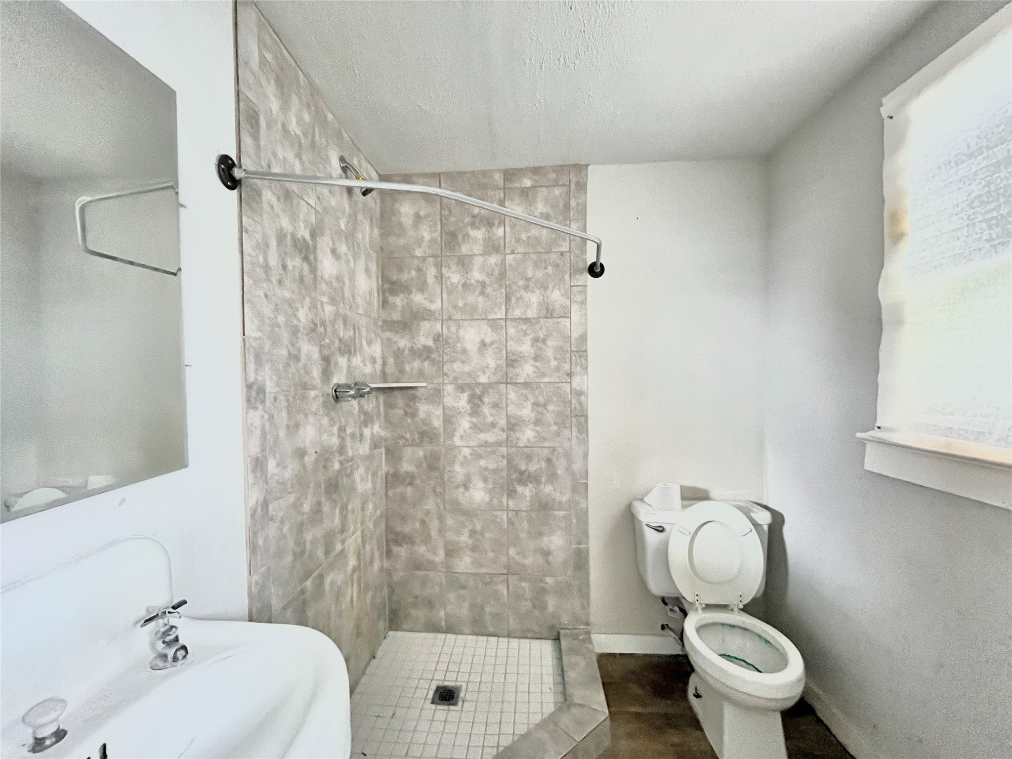 6823 Ave East Houston, TX 77011 - Photo 6 of 16 a bathroom with a sink toilet and shower