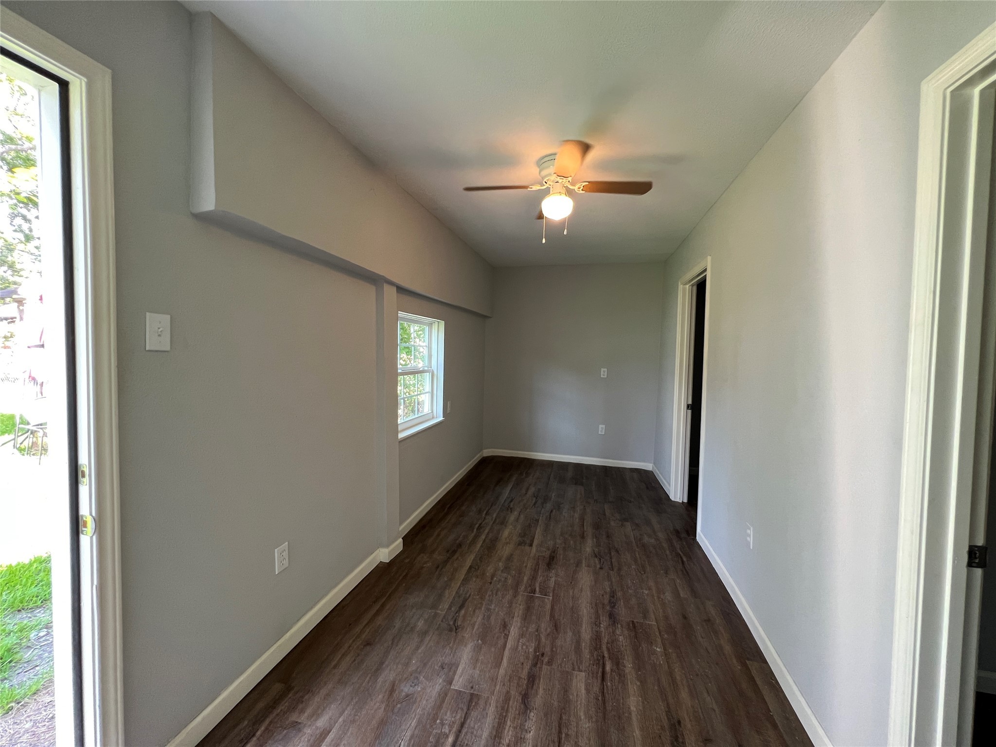 6823 Ave East Houston, TX 77011 - Photo 10 of 16 a view of an empty room with wooden floor and a window
