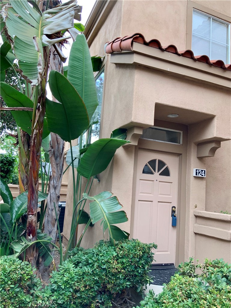 124 Cartier Aisle Irvine, CA 92620 - Photo 1 of 31 a front view of a house with garden