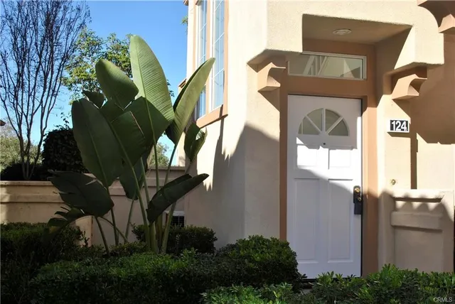 a view of a house with a flower garden