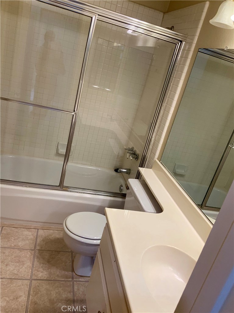 124 Cartier Aisle Irvine, CA 92620 - Photo 21 of 31 a bathroom with a toilet and a shower
