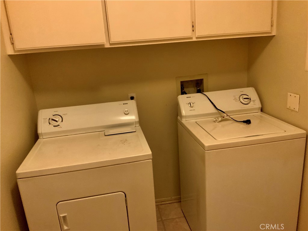 124 Cartier Aisle Irvine, CA 92620 - Photo 22 of 31 a utility room with dryer and washer