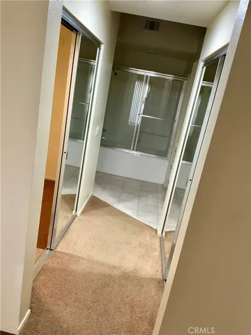 a bathroom with a shower and a sink