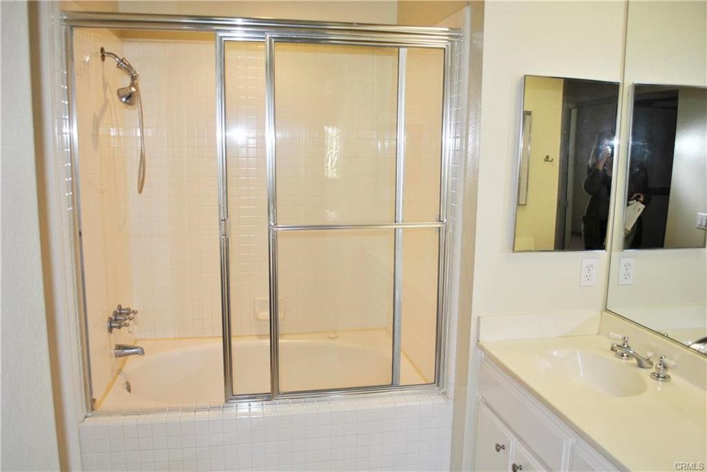 124 Cartier Aisle Irvine, CA 92620 - Photo 30 of 31 a bathroom with a shower and a sink