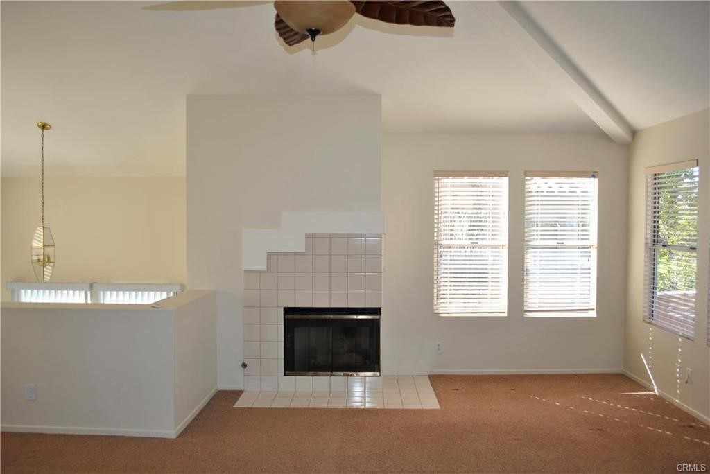 124 Cartier Aisle Irvine, CA 92620 - Photo 5 of 31 a living room with furniture and a fireplace