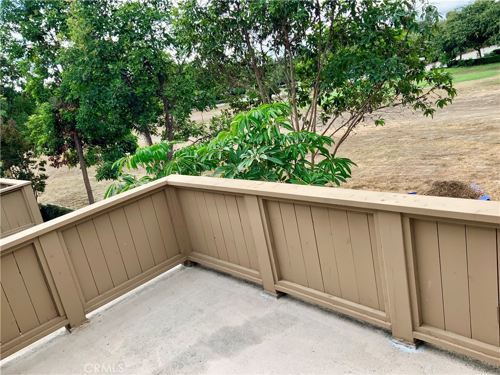 124 Cartier Aisle Irvine, CA 92620 - Photo 8 of 31 a view of a balcony with wooden fence
