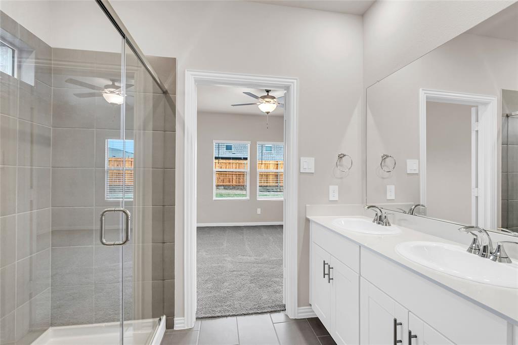 417 Martell Road Lowry Crossing, TX 75069 - Photo 18 of 29 a spacious bathroom with a double vanity sink mirror and shower