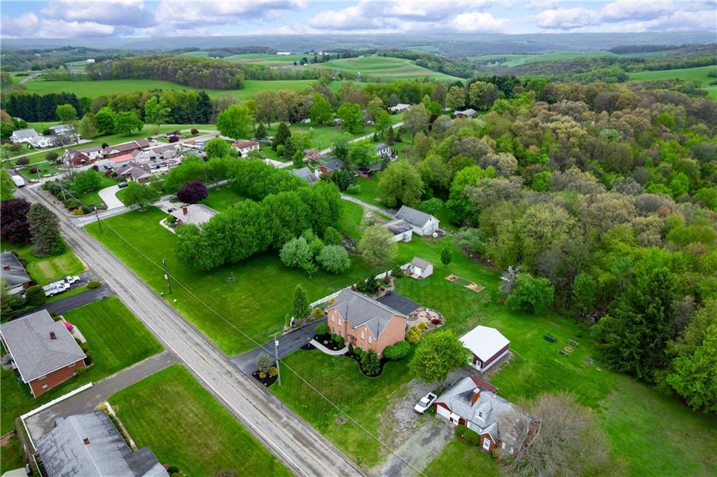 829 Hartzell School Road New Brighton, PA 15066 - Photo 43 of 50 a view of a city with lush green forest