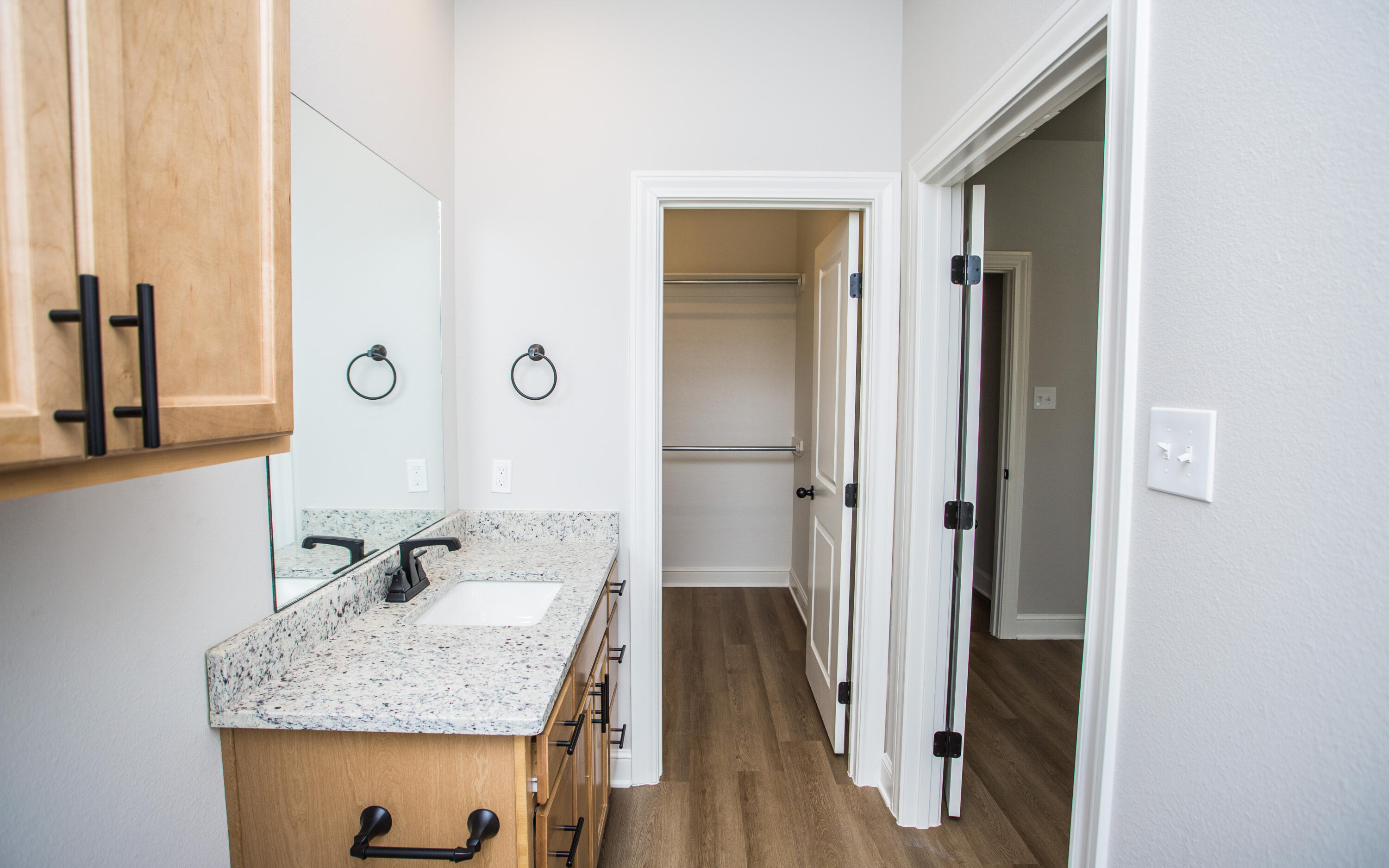 2544 137th Street Lubbock, TX 79423 - Photo 18 of 43 a bathroom with a granite countertop sink and a mirror