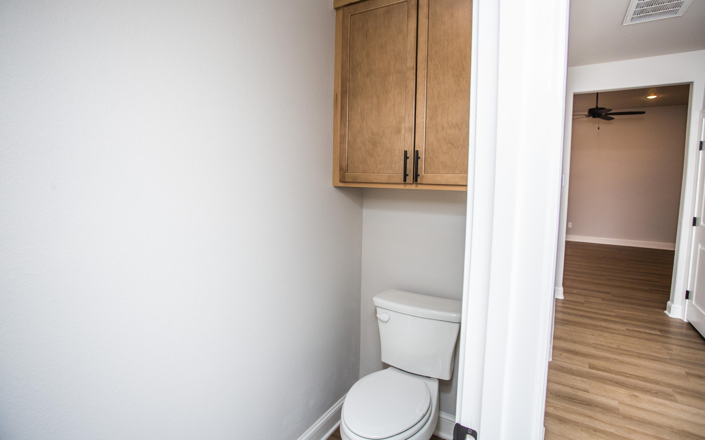 2544 137th Street Lubbock, TX 79423 - Photo 30 of 43 a white toilet sitting next to a shower